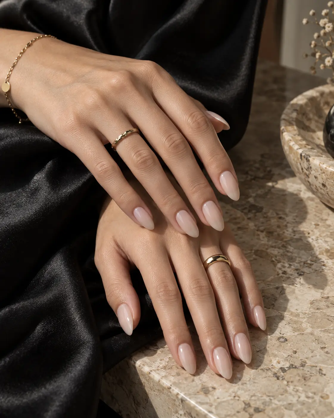 Milky nude almond manicure on a model's hands
